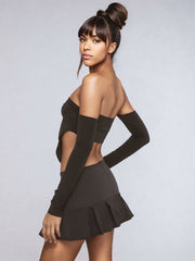 Low-rise pleated mini skirt in black with fold-over detail.