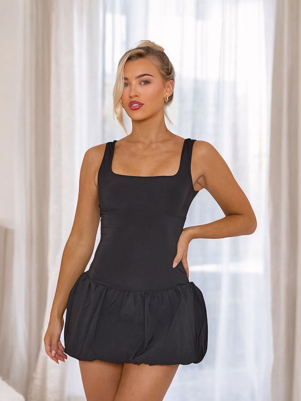 Midnight Party Puffball Mini Dress, a stylish women's fashion piece featuring a flattering puffball silhouette and chic midnight hue. Perfect for special occasions and night outs.