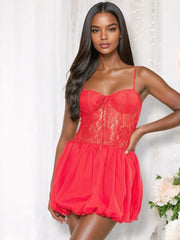  A vibrant red puff ball mini dress featuring a lace bodice with underwire and padded cups, a sweetheart neckline, thin adjustable straps, and a playful puffball skirt with a tie-up detail at the front.